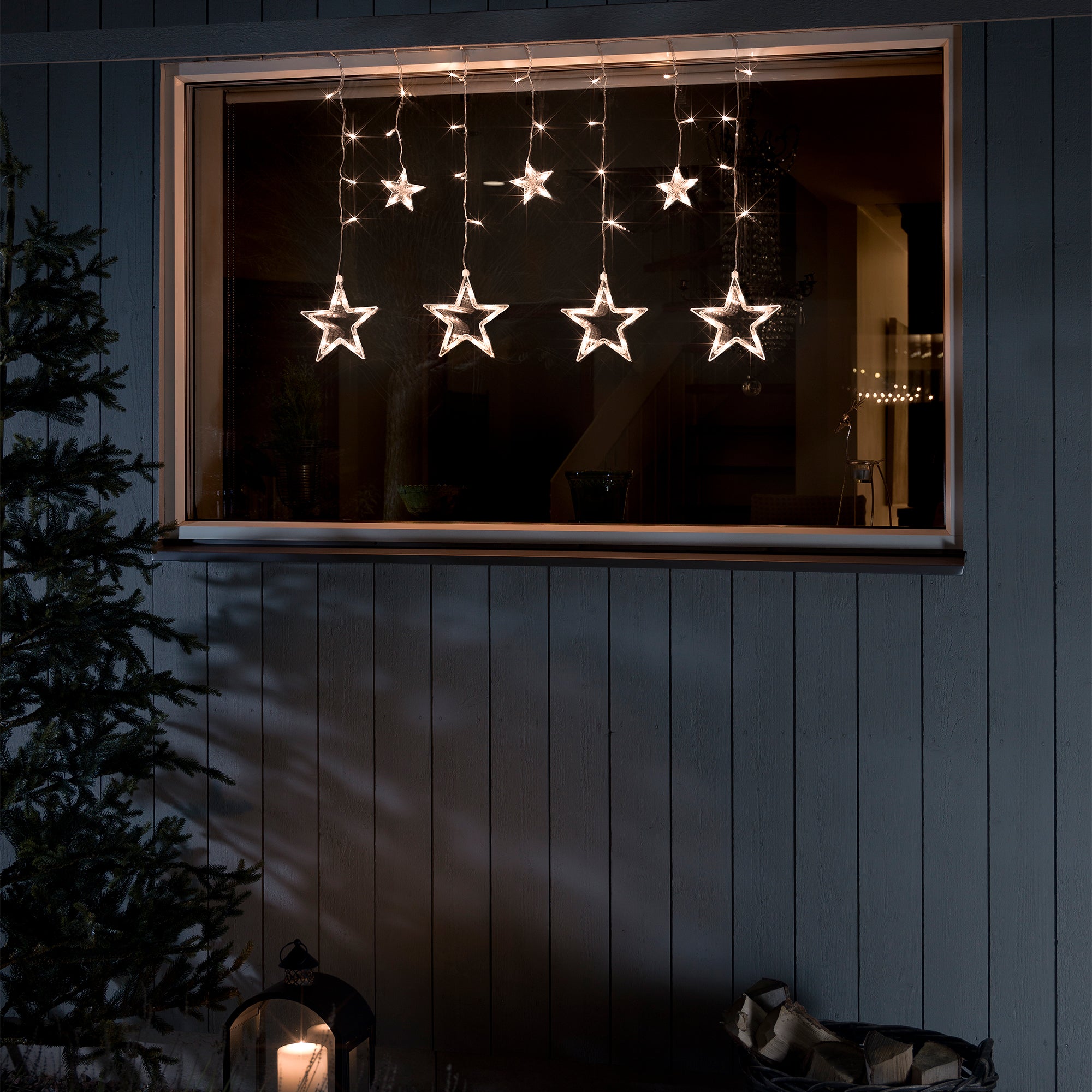 Konstsmide Lysgardin 7 stjerner, 77 ravfarvet LED